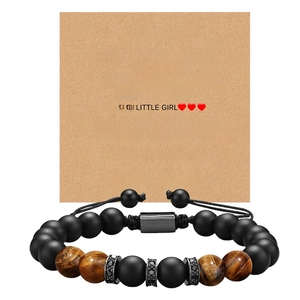 Tiger eye and matte stone beaded bracelet for men on a kraft paper gift message card