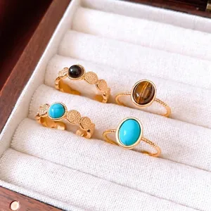 Vintage 18k gold plated tiger eye and turquoise ring set on white velvet
