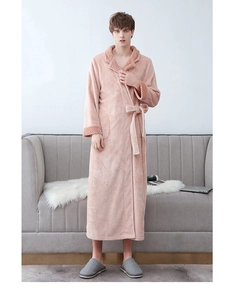 Detailed texture of pink coral fleece bathrobe collar and soft plush fabric material