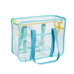 Large waterproof transparent mesh beach bag with blue handles and star pocket detail