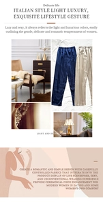 Detailed view of high-shine satin lounge pants in champagne and dark navy blue silk texture