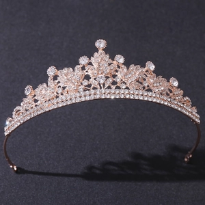 Elegant rose gold bridal tiara with leaf and flower patterns in sparkling white crystals