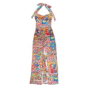 Detail of colorful halter neck dress with tropical prints and side slit design