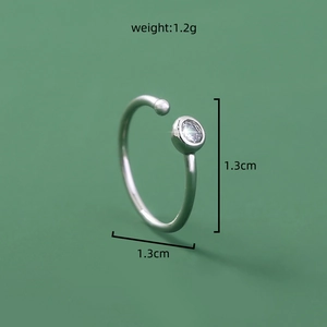 Detailed view of silver U-shaped nose ring with measurements 1.3cm and 1.2g weight