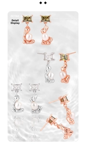 Detailed macro view of S925 silver earrings with irregular pearls and zircon stones