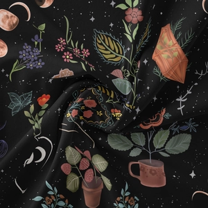 Close-up of black bohemian tapestry with intricate tree of life and starry sky moon prints