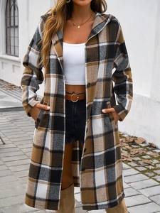 Outdoor shot of long hooded plaid coat with buttons in brown, black and white colors