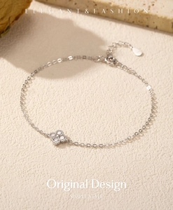 Detail of s925 sterling silver four-leaf clover bracelet with sparkling zircons