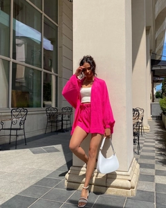 Chic rose pink two-piece set featuring loose long-sleeved shirt and high-waist drawstring shorts