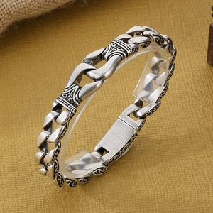 Close-up of vintage silver men's thick chain bracelet with 316L stainless steel engraving