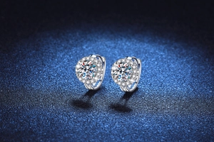 Macro shot of halo design s925 silver sunflower moissanite earrings with a polished finish