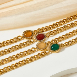 Vintage style gold chain bracelets with colorful oval gemstones and shimmering rhinestones