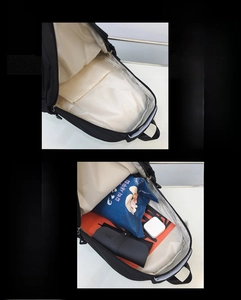 Detailed view of the black backpack spacious main compartment and internal storage pockets