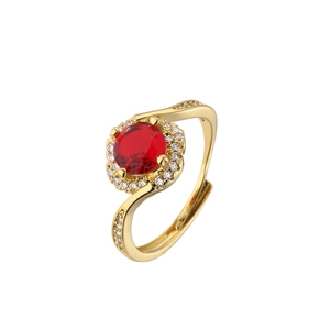 Close-up of 18K gold plated ring with round red zircon and side stones in geometric style
