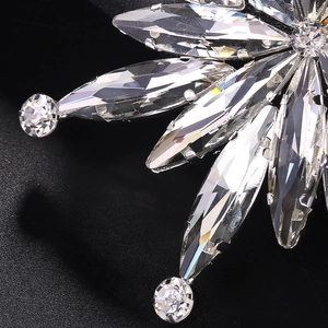 Elegant snowflake brooch with marquise cut crystals and silver finish for luxury suits