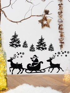 Stickers muraux de Noël noirs avec traîneau du Père Noël et rennes sur un mur blanc