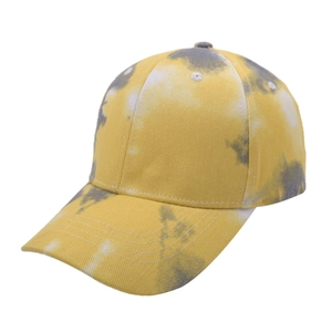 Detail view of tie-dye baseball cap with breathable cotton canvas and yellow-grey patterns