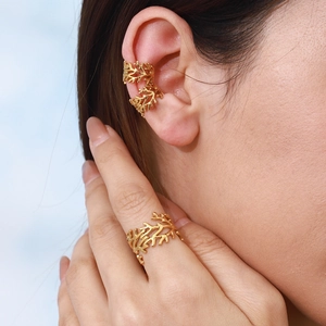 Gold branch textured stainless steel cuff earring and ring set on female model