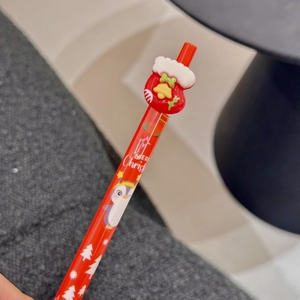 Detail of red Christmas gel pen with a 3D stocking topper and Merry Christmas print