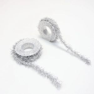 Detail of silver metallic tinsel ribbon rolls for Halloween DIY and gift packaging