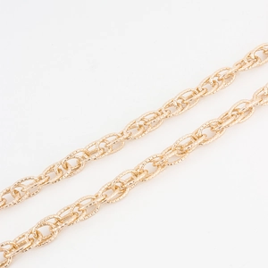 Elegant gold metal flower chain belt accessory for dresses and jeans on white background
