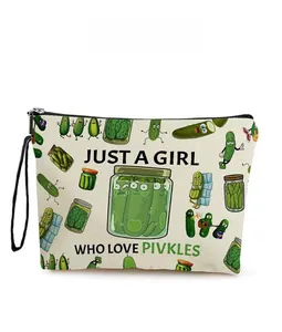 Detail of canvas toiletry bag featuring pickle cartoon patterns and zipper closure