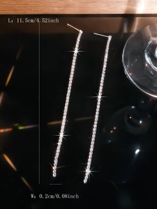 Macro shot of long tassel earrings with rhinestones showing dimensions 11.5cm length