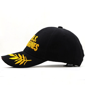 Side view of black U.S. Marines baseball cap with yellow embroidery and laurel leaf visor