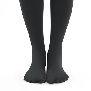 Detail of matte black fleece-lined thermal leggings with a seamless footed design