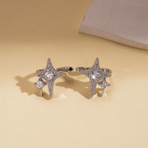 Macro shot of silver star ear cuff featuring square cubic zirconia and micro-pave setting