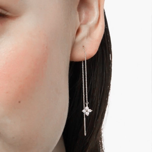 Close-up of S925 sterling silver butterfly drop earrings with cubic zirconia stones