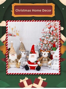 Macro detail of silver plush Christmas figurines including Santa, reindeer and snowmen
