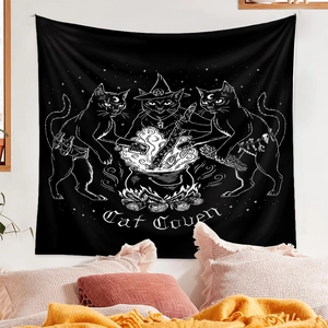 Detailed view of Cat Coven black tapestry with white mystical illustrations on a bedroom wall