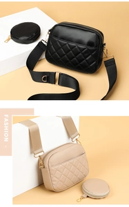 Close-up of quilted crossbody bag set with wide woven strap in black and beige