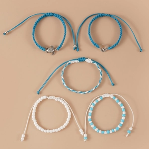 Set of five adjustable handmade woven turtle and wave bracelets with blue beads