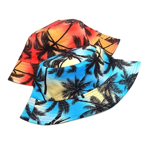 Double-sided bucket hat with tropical coconut tree print in sunset orange and sky blue
