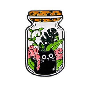 Cartoon enamel pin featuring black cat in glass bottle with tropical Monstera leaves