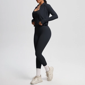 Three-piece black yoga set including a zip jacket, sports bra, and high-waist leggings