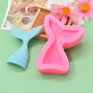 Detailed view of pink mermaid tail silicone mold with scale texture for DIY cake decor