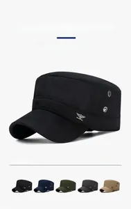 Detailed view of breathable metal eyelets and eagle logo on cotton flat top cap