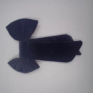 Close-up of deep blue velvet double-layered butterfly bow for wedding and party decor