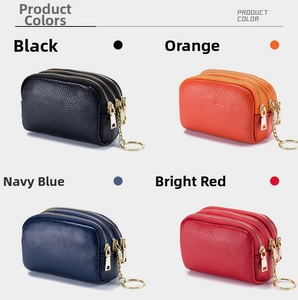 Detailed view of 3-layer zipper mini wallets in black, orange, navy blue and red leather