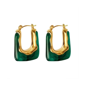 Elegant U-shaped gold earrings with green marble resin inlay on white background