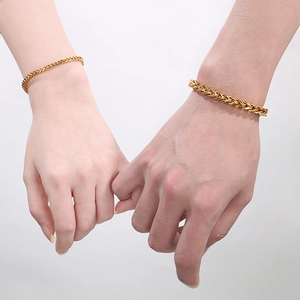 Golden wheat link bracelet set for couples in thin and thick sizes worn by models