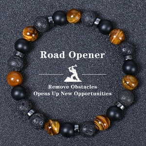 Detailed view of 8mm tiger eye, lava stone, and matte onyx beads on a road opener bracelet
