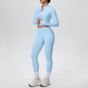 Three-piece light blue fitness set with zip-up jacket, sports bra, and high-waist yoga pants