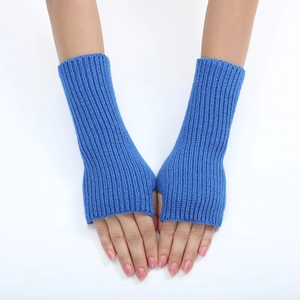 Close-up of blue striped knitted fingerless gloves worn on hands for winter fashion