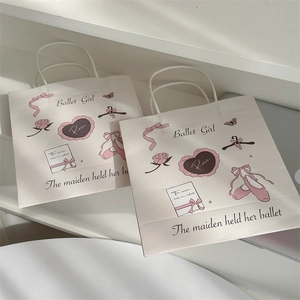 Detail of pink Ballet Girl kraft paper gift bags with floral patterns and bow designs