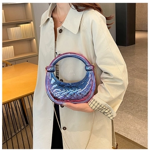 Detail view of a crescent-shaped acrylic bag with purple-blue gradient and quilted texture