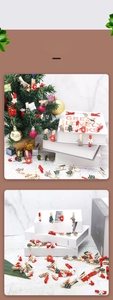 Christmas wooden clips featuring snowflake, reindeer and tree shapes on marble background